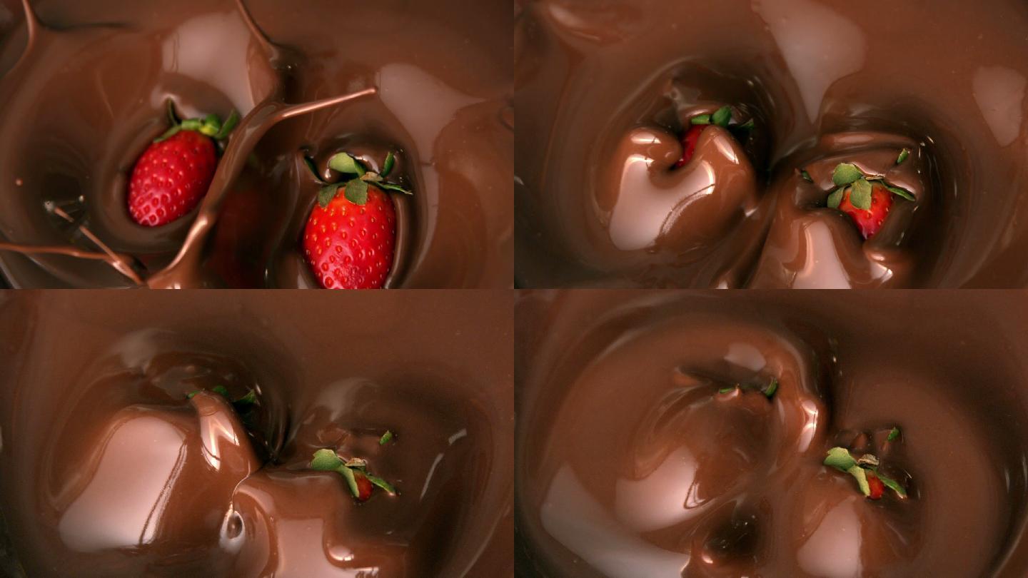 草莓落入融化的巧克力中的慢镜头