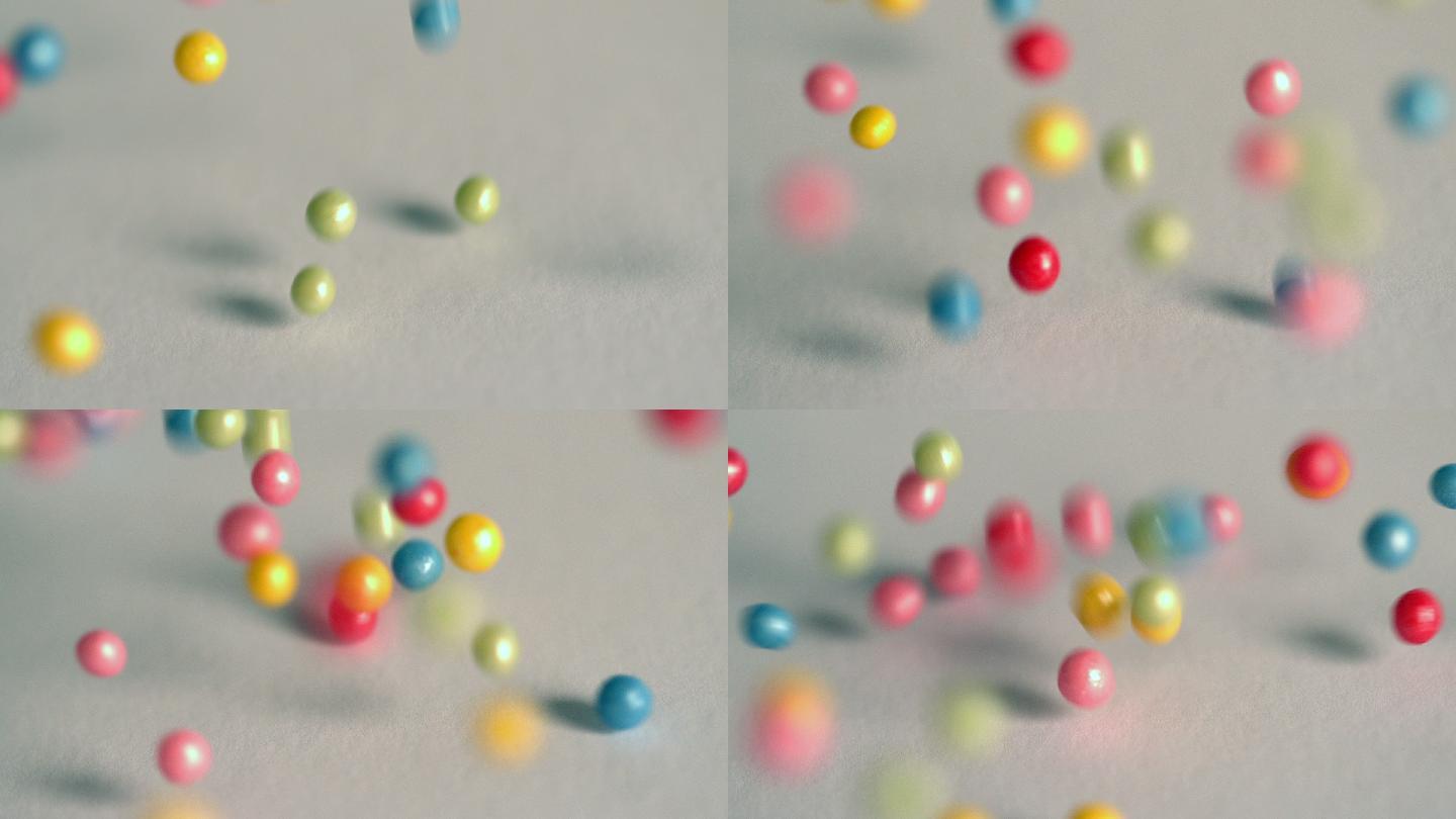 糖球在慢镜头中落在灰色的表面上
