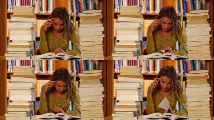 在大学里专注于图书馆学习的学生，周围都是书