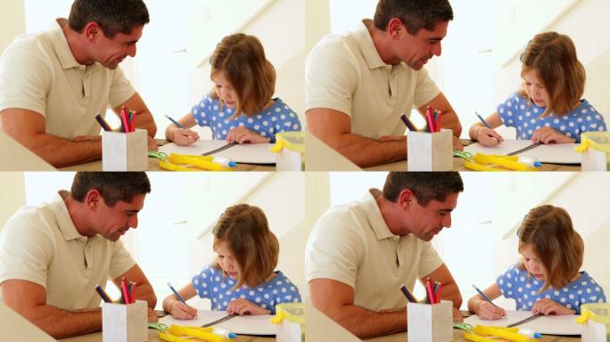 父亲和女儿在客厅里一起画画