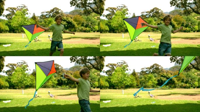 慢镜头里，小男孩在公园里玩风筝