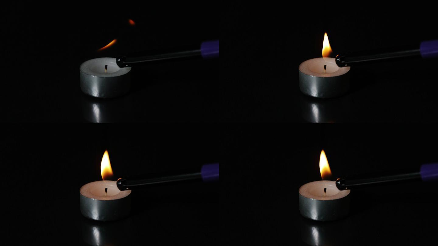 打火机在慢镜头中点燃一支茶灯蜡烛