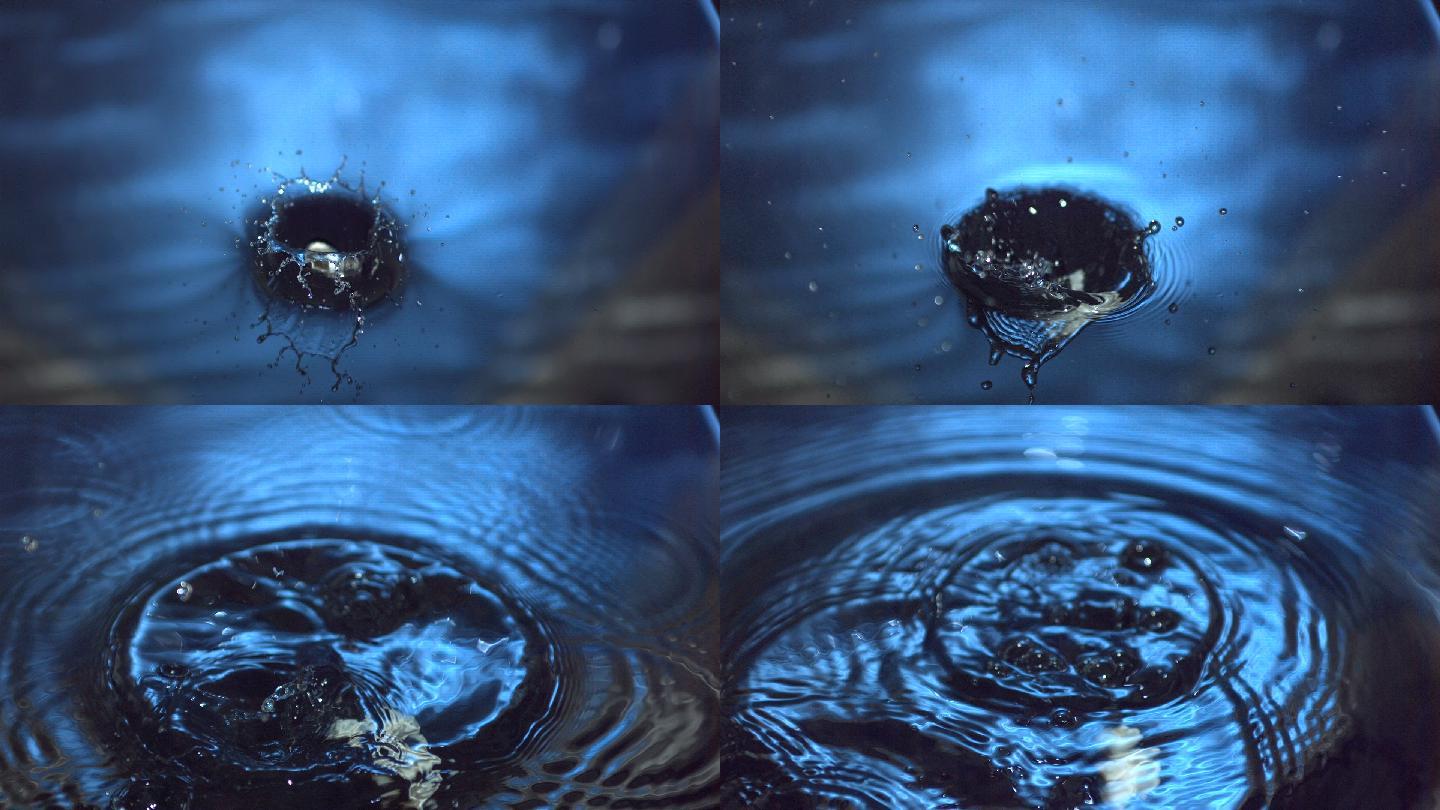 海贝在慢镜头中掉进蓝色的水中