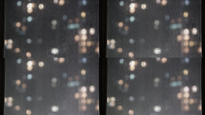 4K雨天的玻璃窗雨夜城市灯火雨天光斑