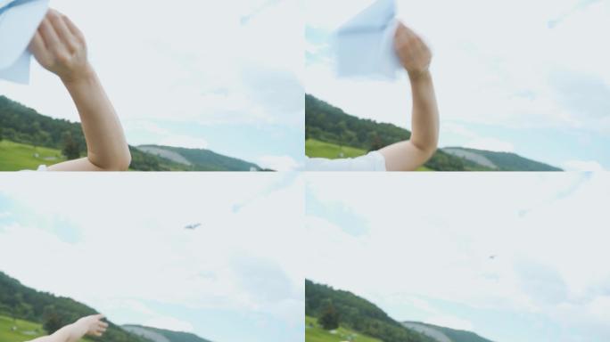 女生扔纸飞机放飞希望梦想蓝天白云纸飞机