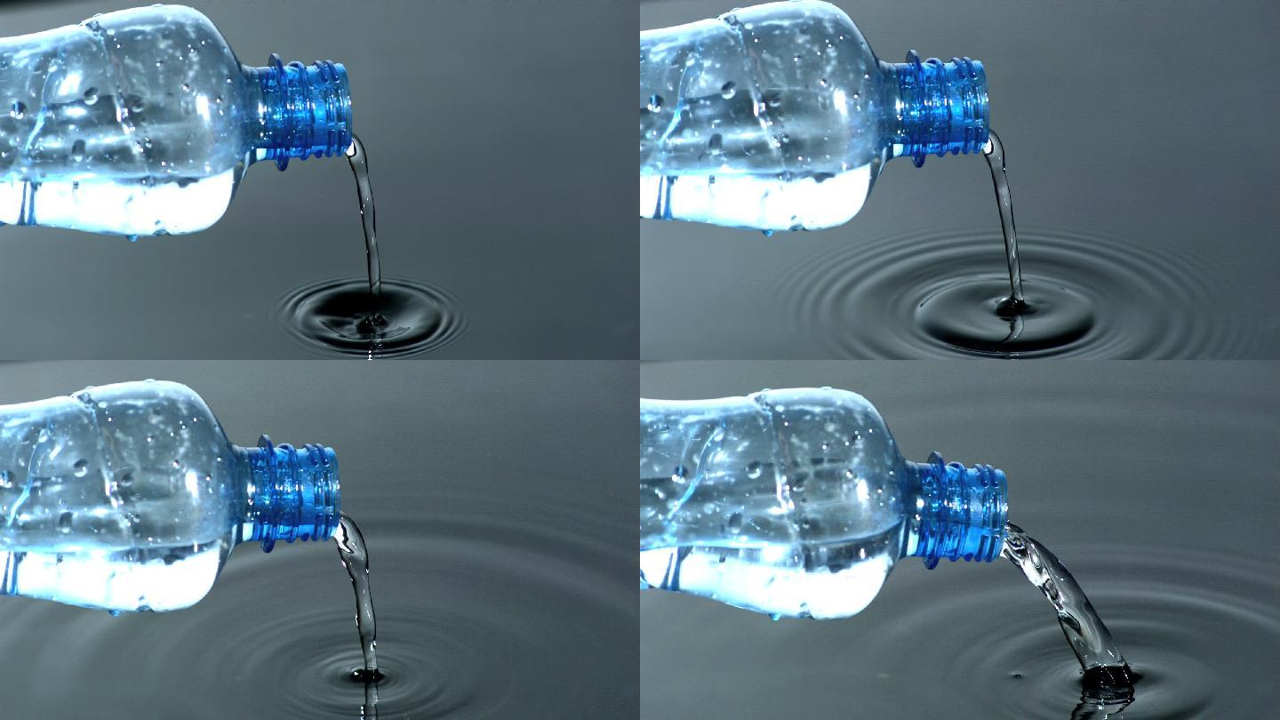 将水从塑料瓶倒入水池特写