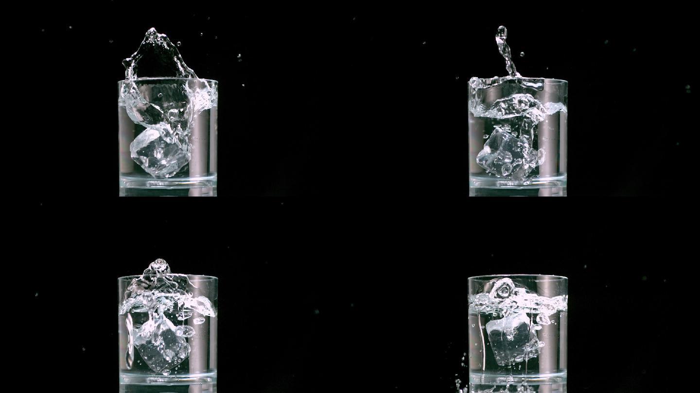 冰块掉入装满水的玻璃杯中特写