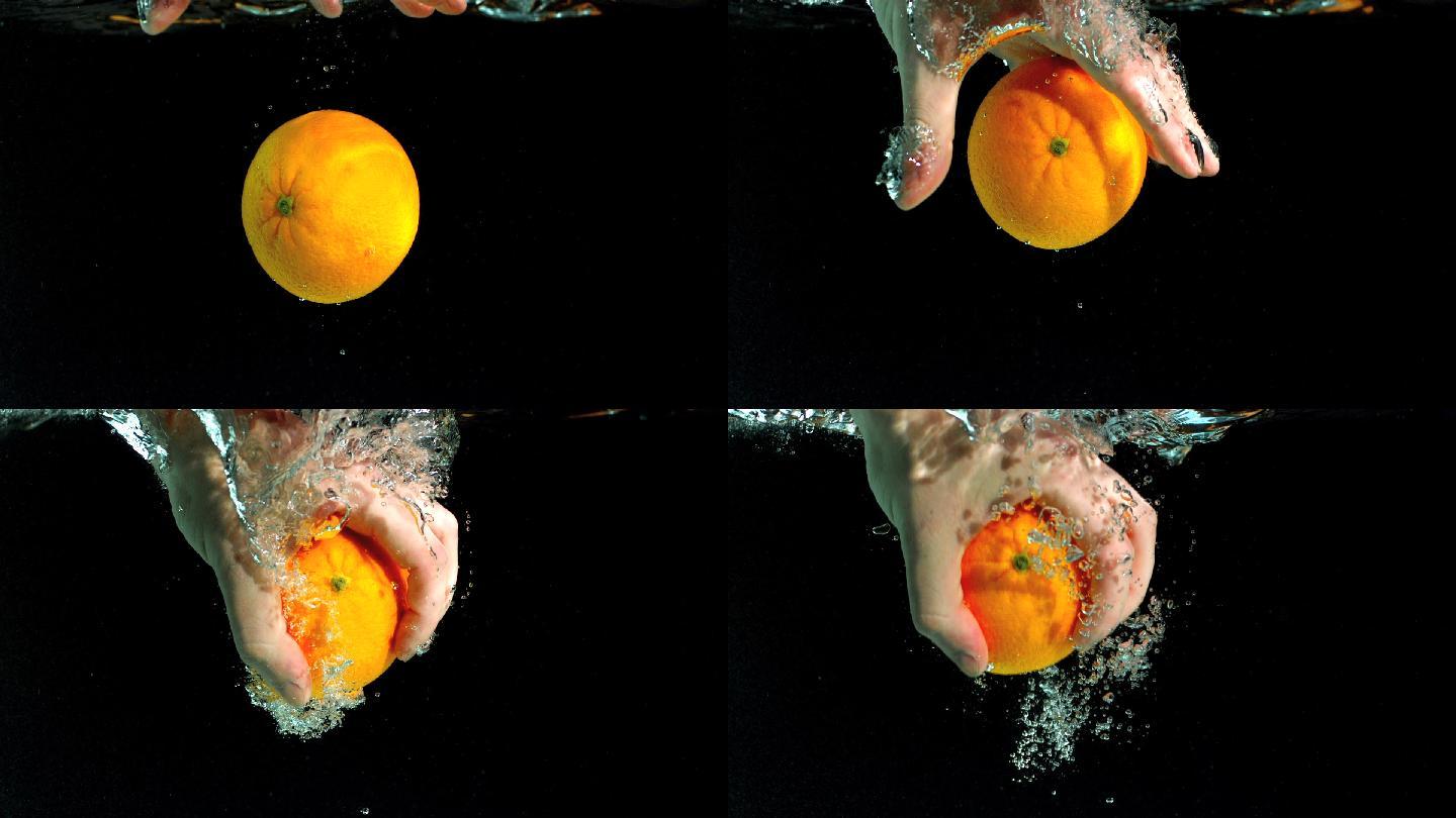 掉入水中的橙子特写