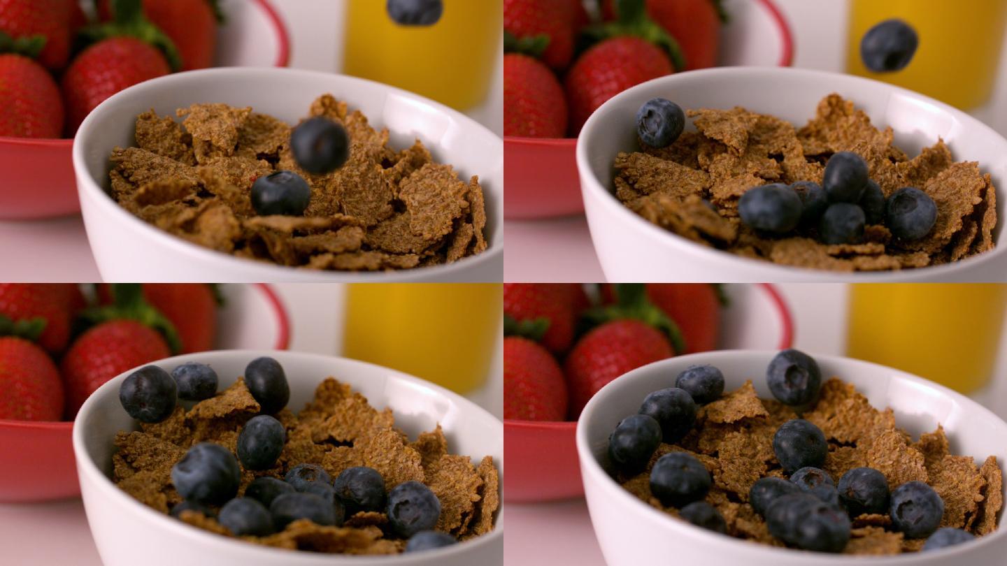 慢镜头里，蓝莓倒进早餐桌上的麦片碗里