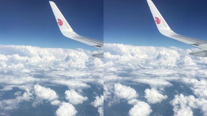 视频素材.飞机舷窗外的云朵竖版