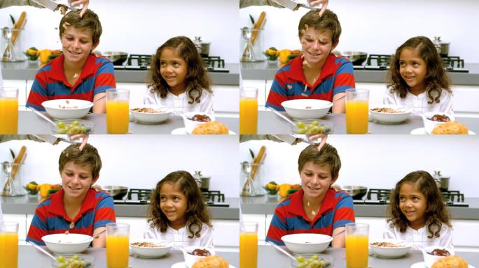 爸爸在吃早餐的时候以每秒500帧的慢镜头把麦片倒进孩子们的碗里