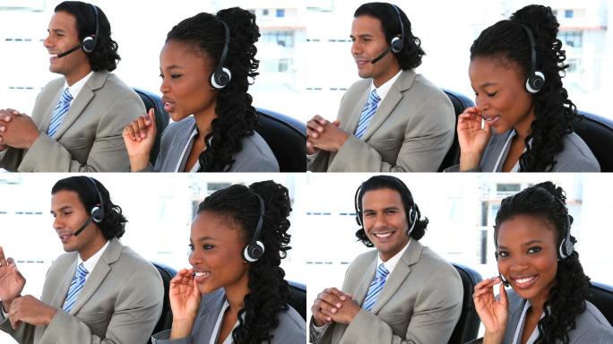 男人和女人戴着耳机在办公室里说话特写