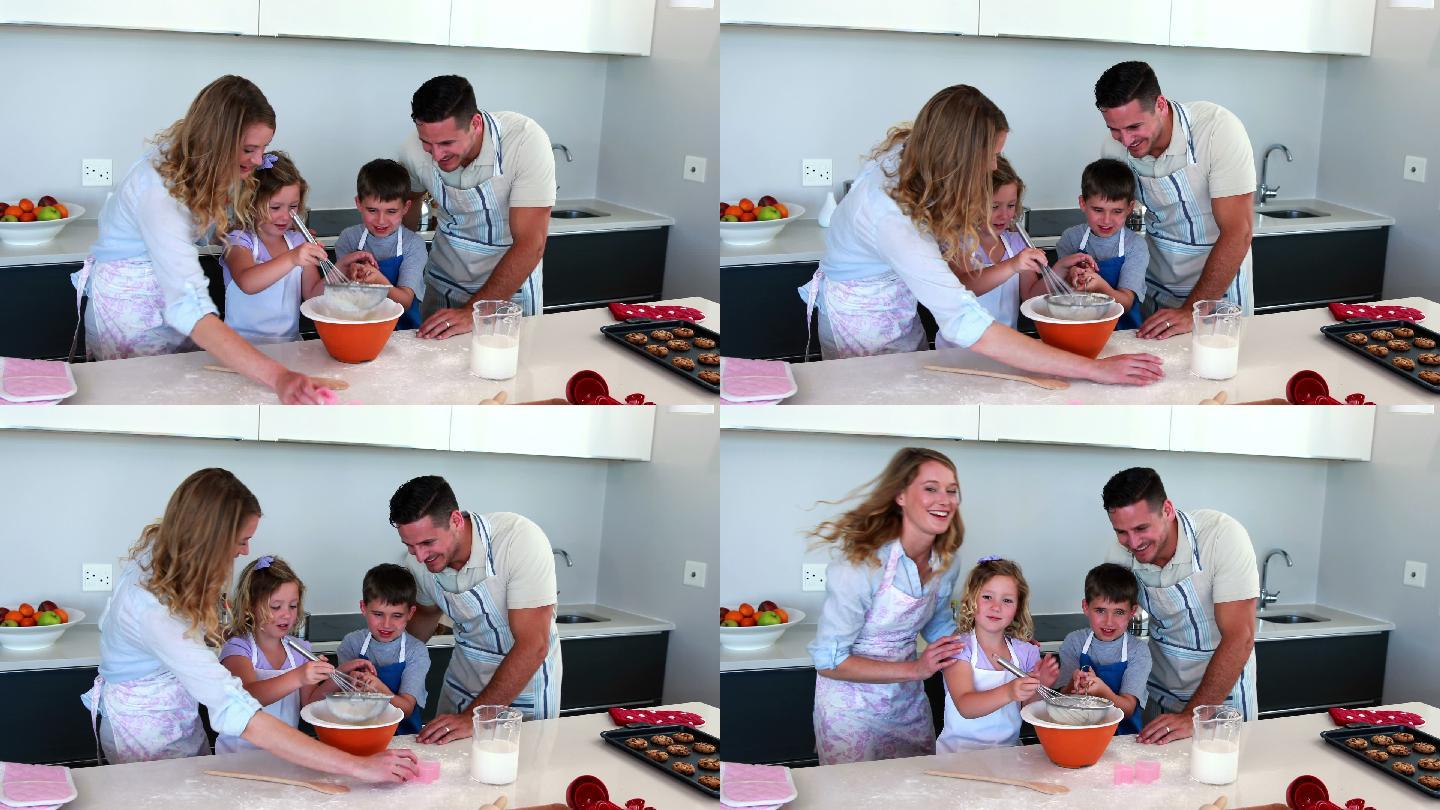 快乐的家庭在厨房里一起做蛋糕