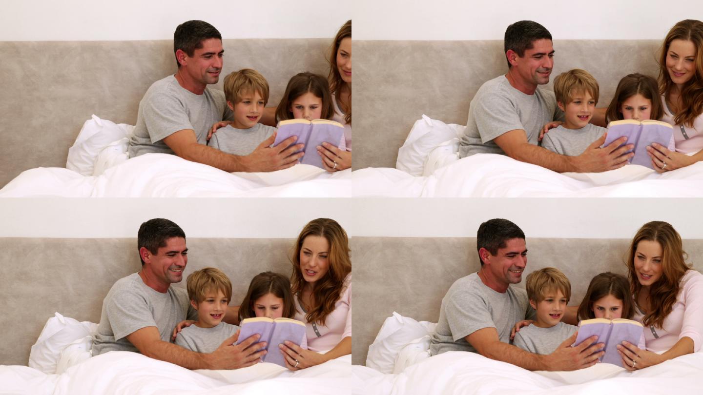 幸福的父母和孩子一起在卧室的床上看书
