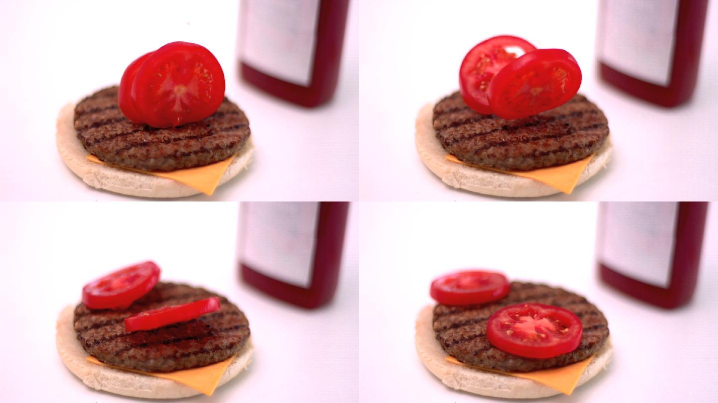 两片西红柿掉到汉堡上特写