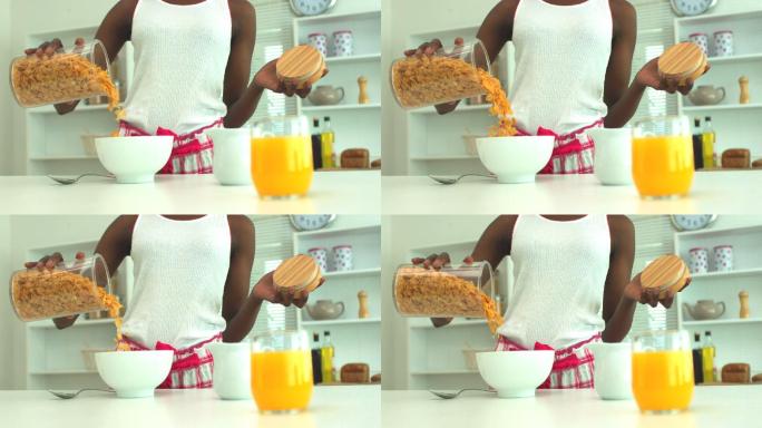 女人把麦片和牛奶倒进碗里特写