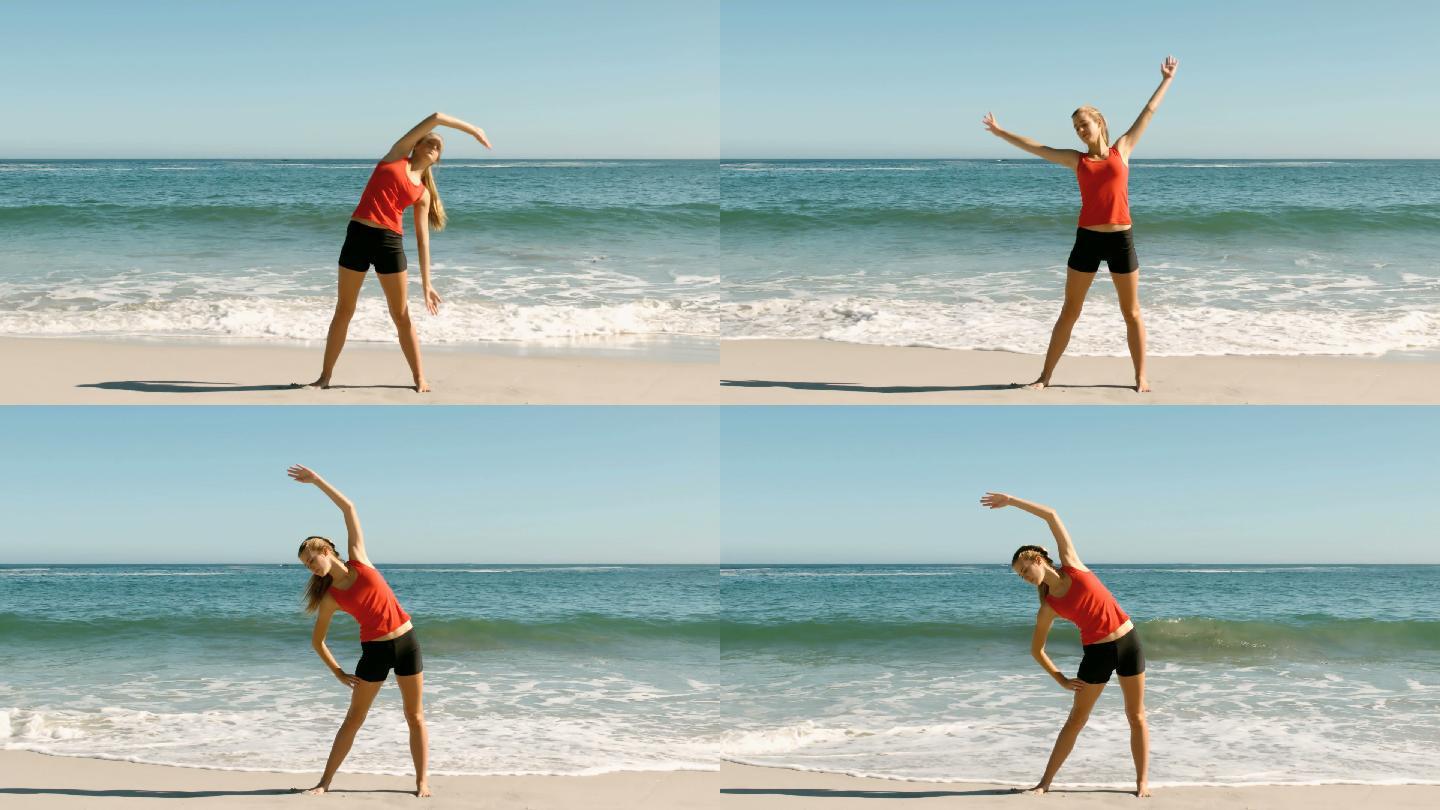 迷人的女人做伸展运动在海滩上的慢动作