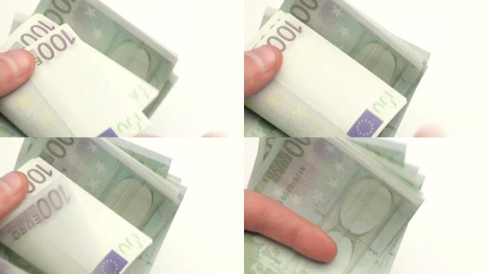 在白色背景下数欧元钞票的人特写