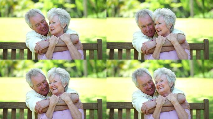 退休男子在公园拥抱他的妻子特写