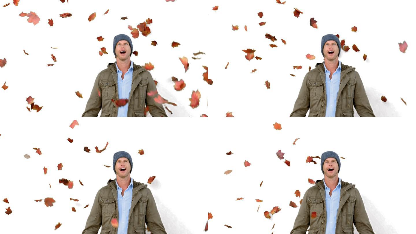 惊奇的男子看着飘落的树叶在白色屏幕上的慢动作