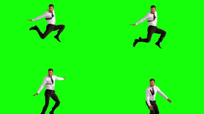 绿色背景下男人欢呼着跳起来特写