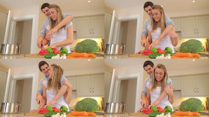 夫妇在厨房一起切蔬菜特写
