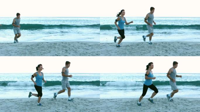 一对情侣在沙滩上跑步锻炼特写