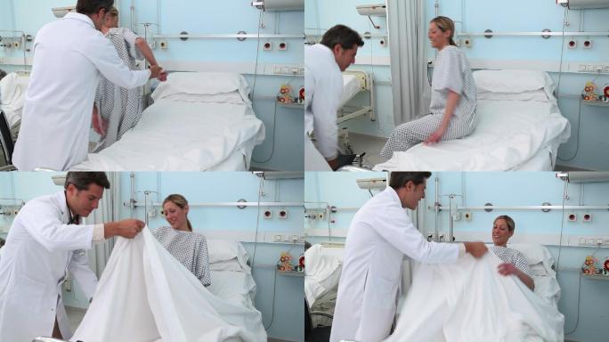 医生协助病人躺在医院病房病床上特写