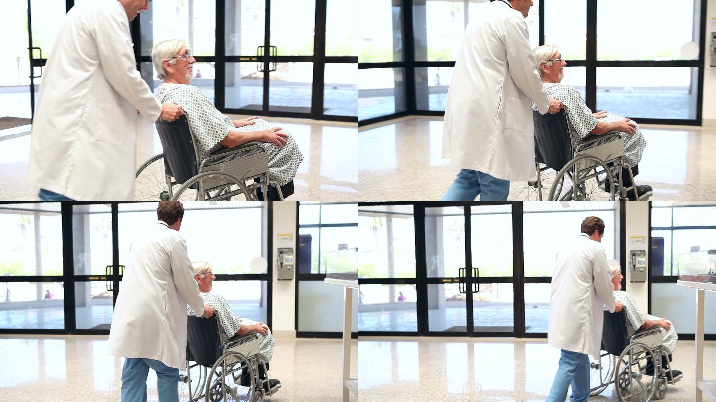 医生用轮椅推着老人在医院里特写