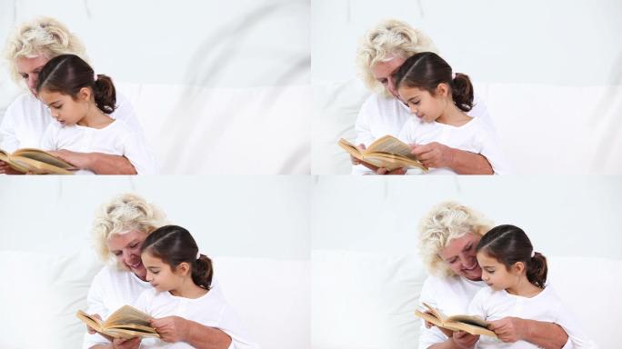 奶奶笑着给孙女读书