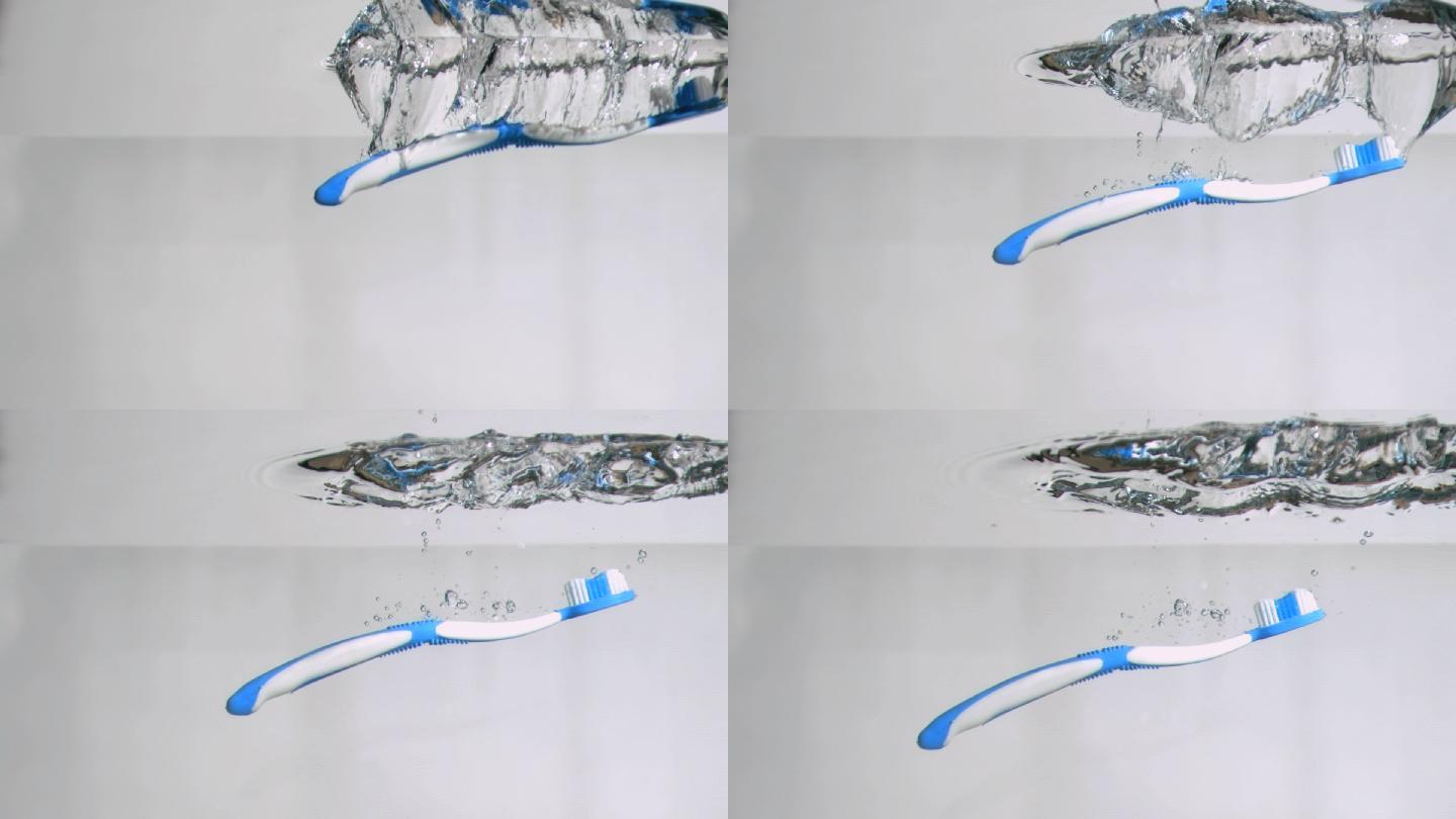 一只蓝色的牙刷落在水中特写