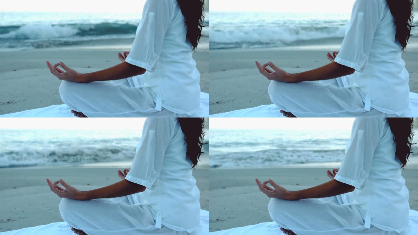 女人在海边练习瑜伽特写