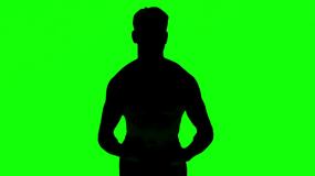 绿色背景下男人剪影展示肌肉特效视频素材