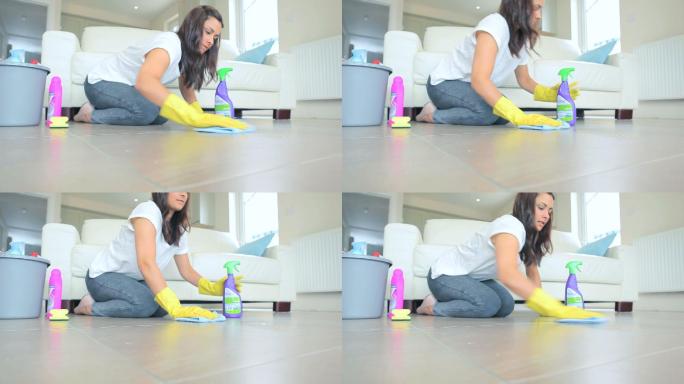 女人用清洁剂擦地板特写