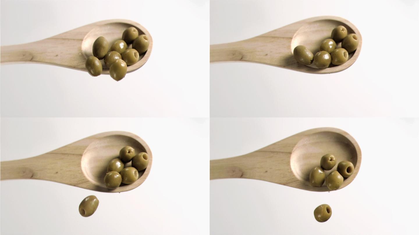 木勺中的橄榄特写掉落美食美味