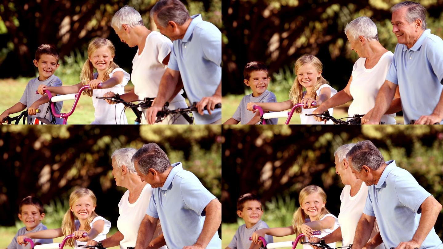祖父母和孩子在公园里骑自行车特写