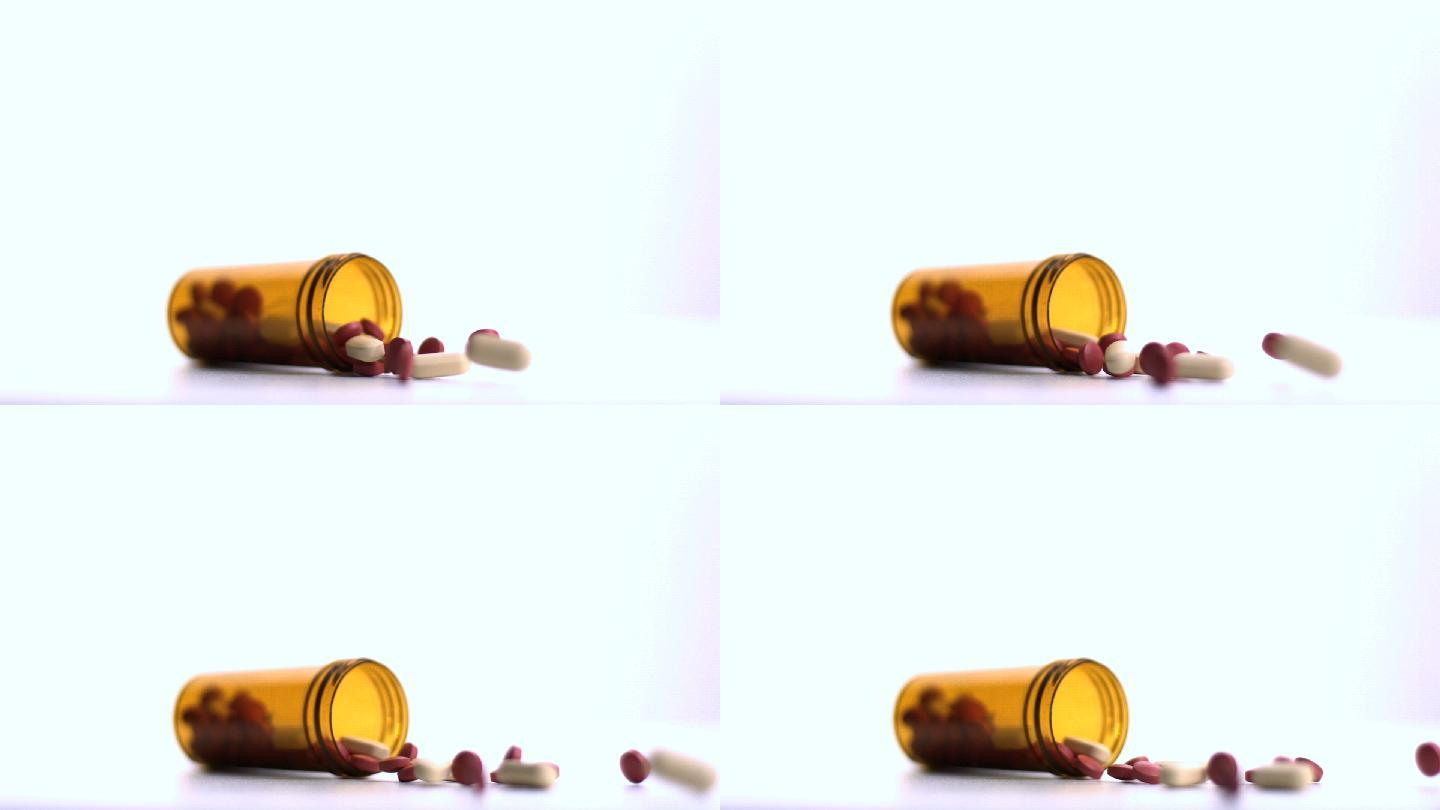一罐药片在慢镜头中溢出