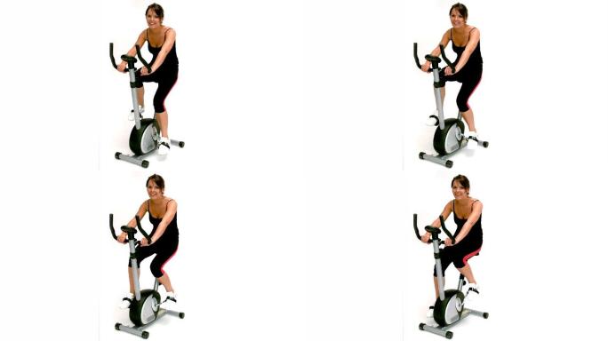 女人在骑动感单车锻炼特写