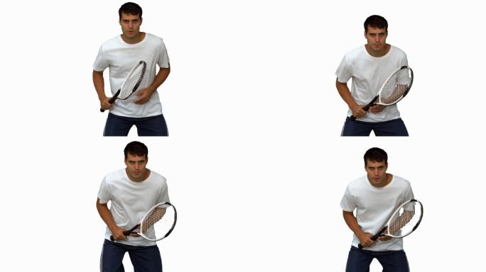 男人在白色背景下练习打网球特写