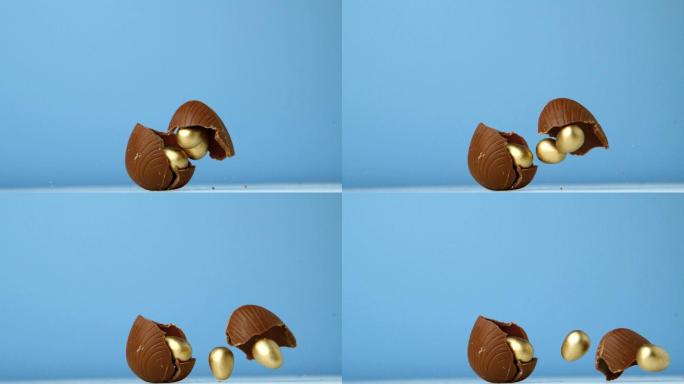 在慢镜头中，巧克力彩蛋在蓝色背景下落下