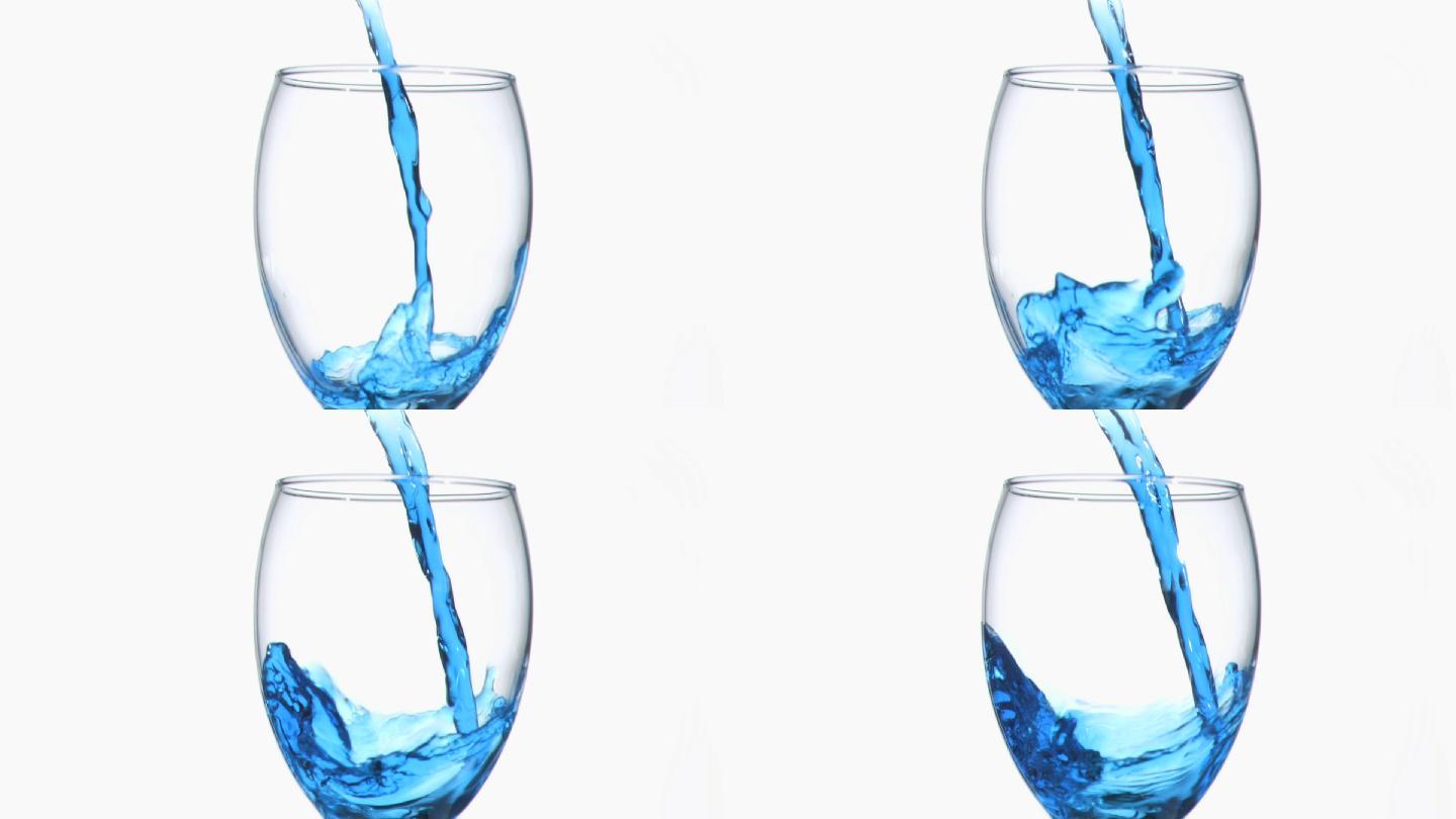 在白色背景下，蓝色液体以超慢的动作在酒杯中流动
