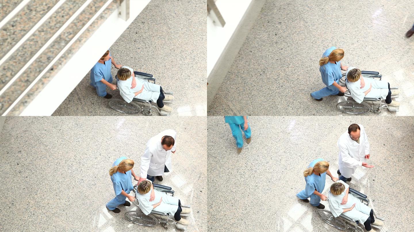 医疗团队用轮椅推着女人在医院里特写