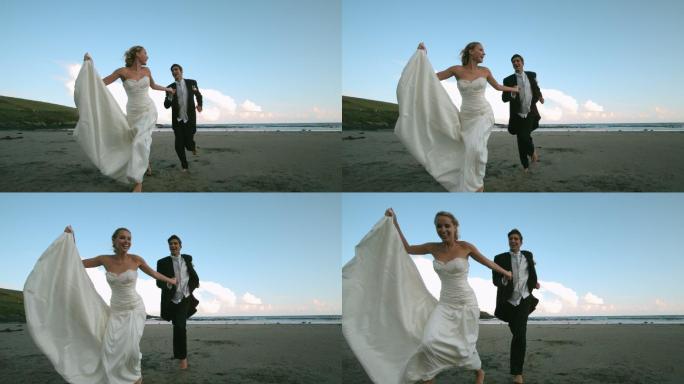 一对快乐的新婚夫妇在沙滩上奔跑的慢镜头