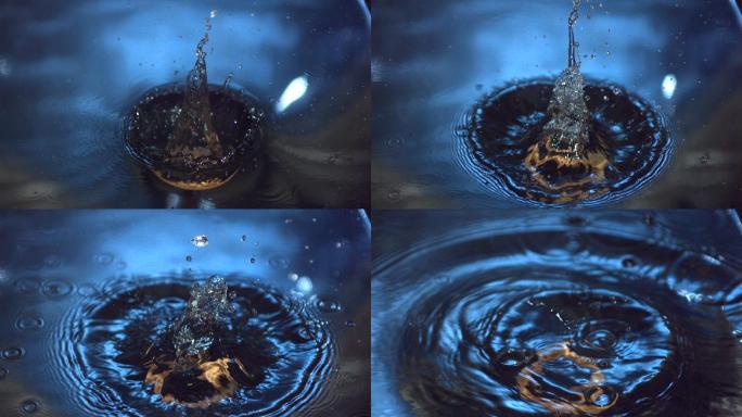 木环在慢镜头中落入蓝色的水中