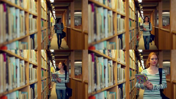 女生抱着书走在图书馆里特写