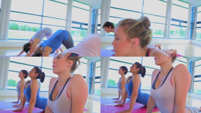 女人们在瑜伽房里健身锻炼特写