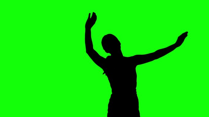 女人的剪影在绿色背景下举起手跳跃特写