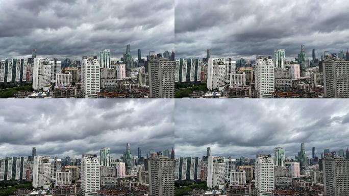 暴风雨来临前城市高楼大厦上乌云翻滚