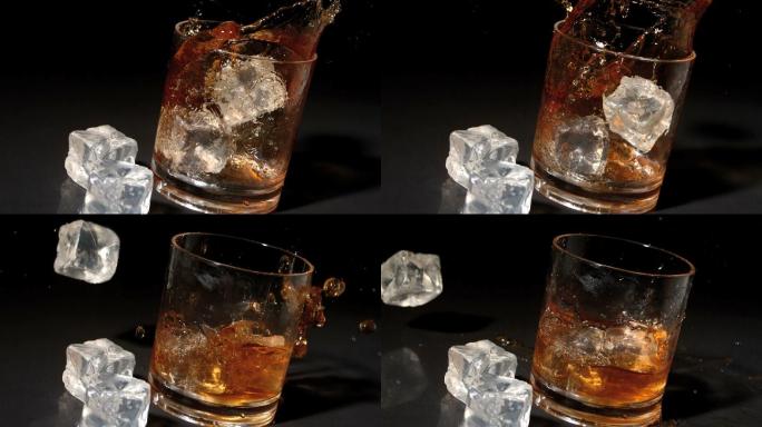 三个冰块掉入威士忌杯中特写