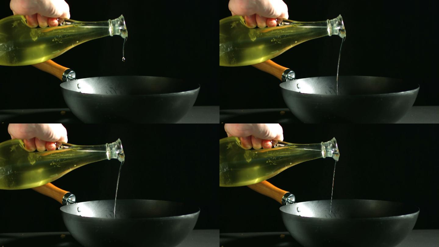人的手将橄榄油倒入锅中特写